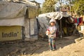 KATHMANDU, NEPAL - poor child near their houses at slums in Tripureshwor district