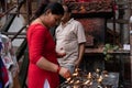 Woman Lighting Lamp