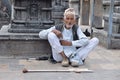 Kathmandu, Nepal, September, 29, 2013, Nepali Scene: elderly man begging in the temple complex of Swayambhunath