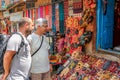 Kathmandu, Nepal - September 22, 2016: Tourist men looking at some souvenirs in front of a shop in Kathmandu, Nepal Royalty Free Stock Photo