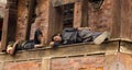 Kathmandu, Nepal; september, 09, 2018: very tired Nepalese men sleeping under a temple in Durbar Square in Kathmandu Royalty Free Stock Photo