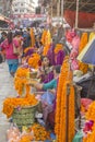 Street vendors of bright colorful fresh flowers for Diwali. street market on pedestrian street Royalty Free Stock Photo