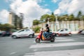 Kathmandu Urban Buzz: moto scooter on the dusty Nepalese streets blurry moving in the car traffic in Kathmandu, Nepal. Pollution,