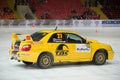 Katkov and Tchaikovsky in racing car on ice Royalty Free Stock Photo