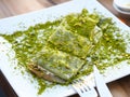 Katmer dessert of Turkey Gaziantep region. Prepared with thin dough dessert with ice cream and green pistachio Royalty Free Stock Photo