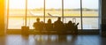 KATOWICE AIRPORT, POLAND - OCTOBER, 2018: Tourists sitting in the airport with suitcases. People are waiting for the flight.