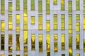 KATOWICE, POLAND, 2021 - Fragment of office building facade made of yellow toned glass and concrete constructions. Royalty Free Stock Photo