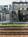 Street art mural painting on wall of old building next to main railway station Royalty Free Stock Photo