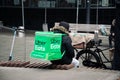 KATOWICE. POLAND - March 26, 2021: Food courier bag for delivery takeaway service. Driver man on bike or motorcycle for Royalty Free Stock Photo