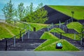 View of green lawns and black stairs near International Congress Hall in Katowice