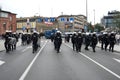 Polish policemen in action, white helmets, plastic covers