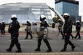 Polish policemen in action, white helmets, plastic covers