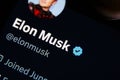 Close-up shot of Elon Musk twitter account. Blue verified icon checkmark