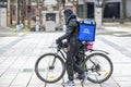 Food delivery courier with bicycle