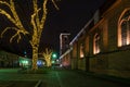 Christmas street view, illuminated decorations and lights by the cathedral basilica in Kaunas Lithuania night scene Royalty Free Stock Photo