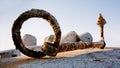 Kavarna, Bulgaria - September 2016: old anchor, covered with small shells, lies on the pier on a concrete slab in the morning sun Royalty Free Stock Photo