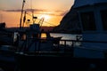 Kavarna, Bulgaria - September 2016: Sunset with a view through a fishing trawler lying in the port