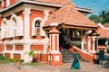 Kavlem, Phonda, Goa, India. Indian Woman Walking Near Shree Shantadurga Mandir, Kavlem Temple. Famous Landmark And