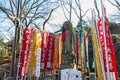 KAWAGOE,SAITAMA PREFECTURE, JAPAN - FEBRUARY 3 ,2016 : Ancient buddha statue and colorful flag at Kitain temple