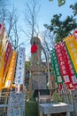 KAWAGOE,SAITAMA PREFECTURE, JAPAN - FEBRUARY 3 ,2016 : Ancient buddha statue and colorful flag at Kitain temple