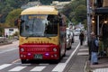 Kawaguchiko, Japan - August 27, 2: japanese old man and Kawaguchiko omnibus traveling bus are stopping at pedestrian crossing road