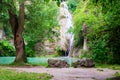 Kaya Bunar / Hotnitsa waterfalls in Bulgaria. Scenic view of the falls with two big rocks and an old tree in front.