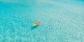 Kayak boat turquoise blue water sea, sunny day. Concept banner travel. Aerial top view