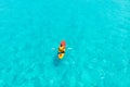 Kayak boat turquoise blue water sea, sunny day. Concept travel. Aerial top view