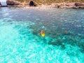 Kayak boat turquoise blue water sea, sunny day. Concept travel. Aerial top view