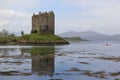 Kayak explores castle stalker loch scotland Royalty Free Stock Photo