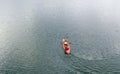 Kayak floats on the river aerial view, top view from a drone, two guys in a canoe Royalty Free Stock Photo