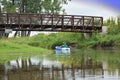 Kayak going under bridge