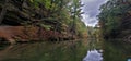 Kayak on mirror Lake state park fall colors and rocky bluff outcrops reflecting in the water Royalty Free Stock Photo