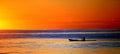 Kayak in ocean at sunset