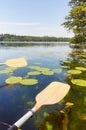 Kayak paddles over the water, ecotourism concept, selective focus