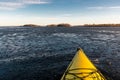 Kayak paddling in icy water