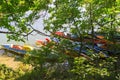 Kayak pier of different colors on the river bank Royalty Free Stock Photo