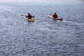 Kayak rowers on a kayak paddling by the sea, active water sport and leisure, kayaking