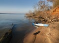 Kayak on the sandy beach with driftwood