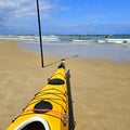 Kayak on the sandy beach, ready to go out to sea