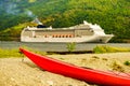 Kayak and cruise ship in Flam, Norway Royalty Free Stock Photo