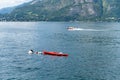 Kayak and speedboat at lake Como Royalty Free Stock Photo