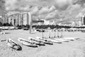 Kayak and surfboards with paddles on sand Royalty Free Stock Photo