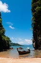 Kayak and Thai wooden longtail boat on the beach, Krabi - Thailand