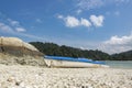 Kayak on tropical sandy beach island and bright sunny day. Royalty Free Stock Photo