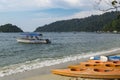 Kayak on tropical sandy beach island and bright sunny day. Royalty Free Stock Photo