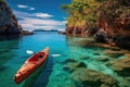 Kayak on the tropical white sand beach with transparent sea on sunny day Royalty Free Stock Photo