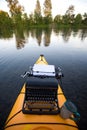 Kayak with a typewriter Royalty Free Stock Photo
