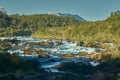 Kayakas on Petrohue falls at the surroundings of Osorno Volcano. Puerto Varas, Chile, South America. Royalty Free Stock Photo