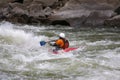 Kayaker battling rapids